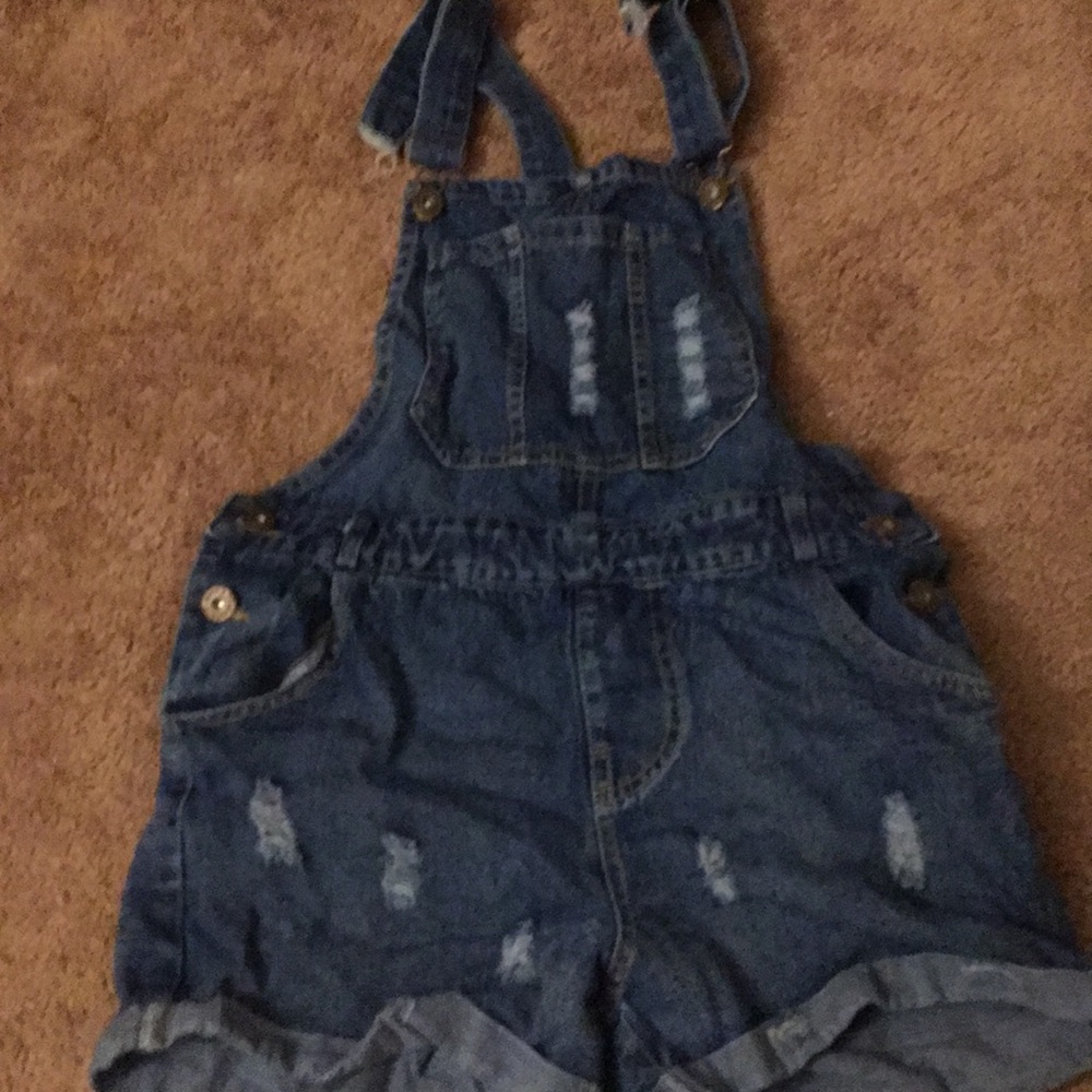 Overalls. Back pockets, pocket in front.
